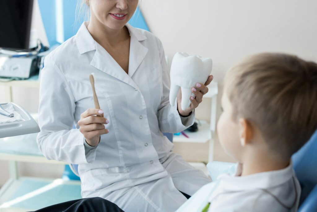 dentist-explaining-dental-care-to-child-1024x684
